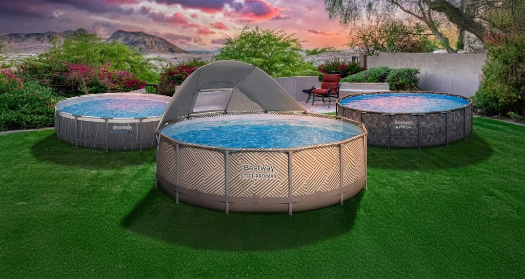 Three Bestway above ground pools on green grass with trees and mountains in the far distance behind the pools.